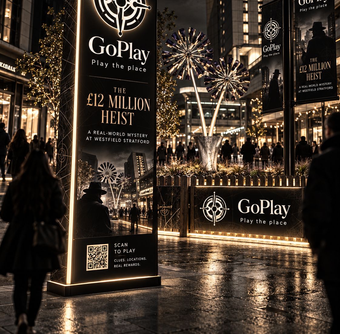 A GoPlay totem advertising The £12 Million Heist, lit up at night in a London plaza